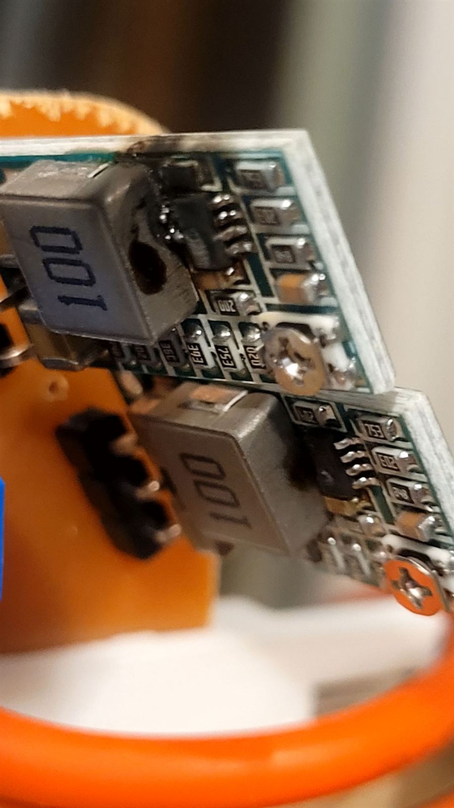 Close-up of a scorched, burnt-out regulator board