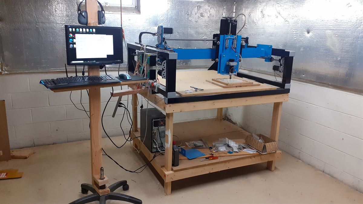 FerrousCNC all-steel DIY CNC router on its workbench in the Whitman Technological workshop